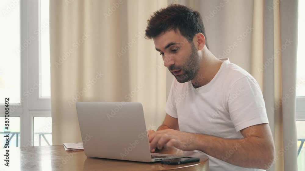 4k video of businessman working in laptop and drinking tea at home. 4k video of businessman working in laptop and drinking tea at home.