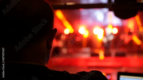 Sound and lighting engineer at an outdoor festival concert