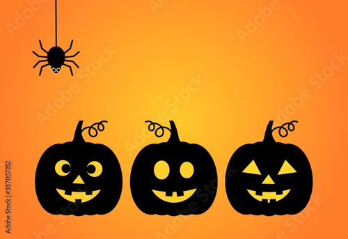 Halloween background with three Jack O Lantern pumpkins and the spider.