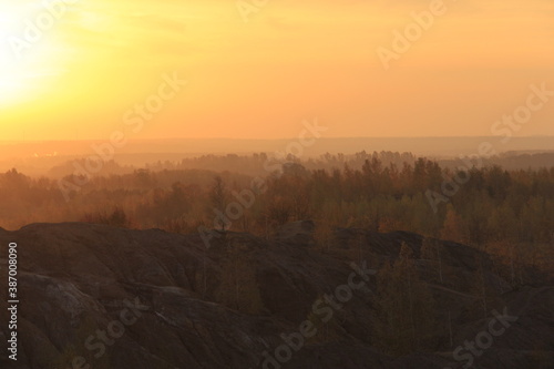 Golden sunrise over the Romantsev mountains in golden autumn