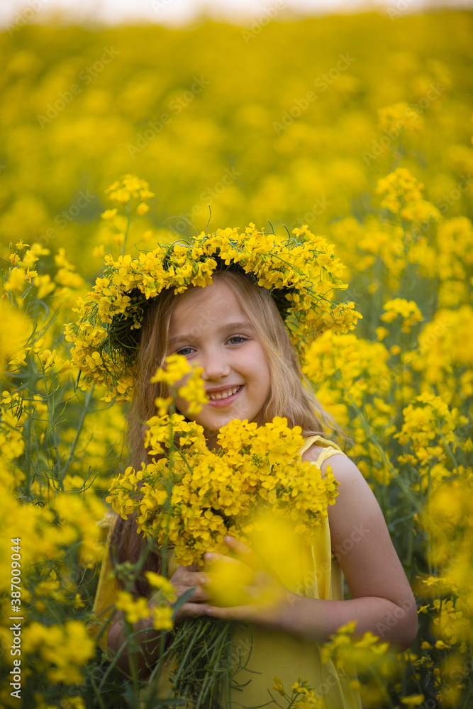 Little cute blonde girl on a rapeseed field Little cute blonde girl on a rapeseed field