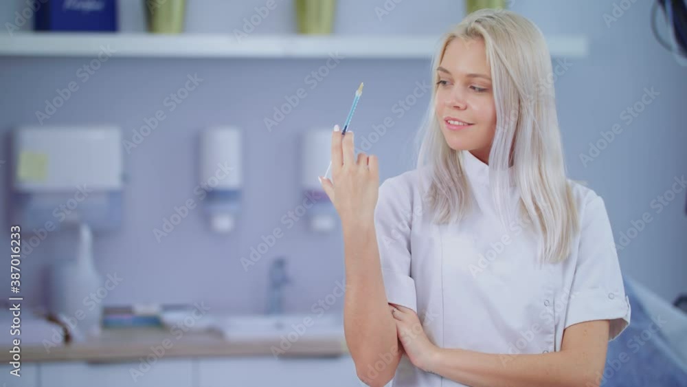 Doctor Or Dentist Portrait In Hospital Or Clinic Hold Syringe With Blue Vaccine Covid19 Young Blonde Caucasian Confident Attractive Woman Slow Motion Medical Aesthetic Medicine Concept Doctor Or Dentist Portrait In Hospital Or Clinic Hold Syringe With Blue Vaccine Covid19 Young Blonde Caucasian Confident Attractive Woman Slow Motion Medical Aesthetic Medicine Concept
