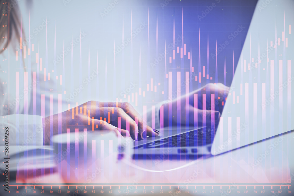 Double exposure of woman hands working on computer and forex graph hologram drawing. Financial analysis concept. Double exposure of woman hands working on computer and forex graph hologram drawing. Financial analysis concept.
