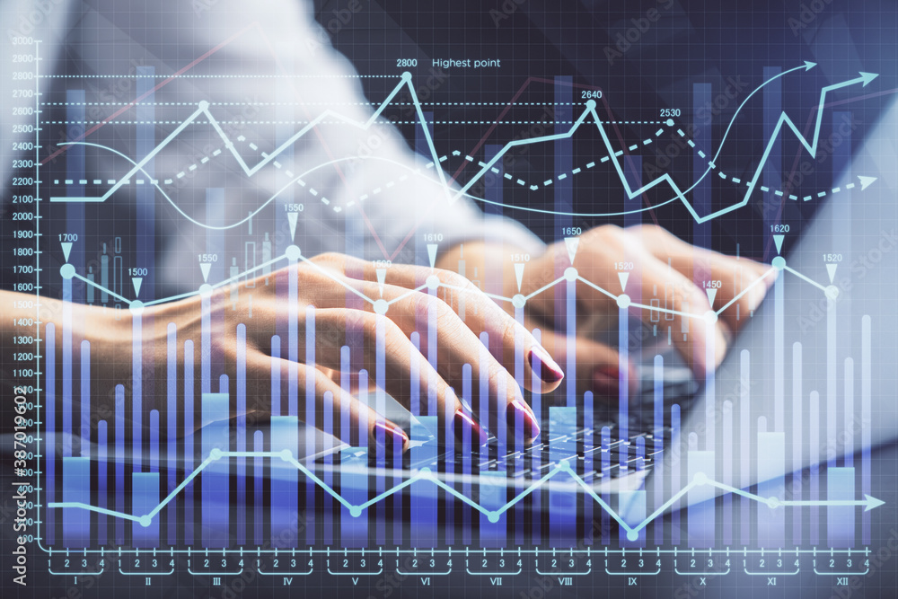 Double exposure of businesswoman hands typing on computer and forex chart hologram drawing. Financial analysis concept. Double exposure of businesswoman hands typing on computer and forex chart hologram drawing. Financial analysis concept.