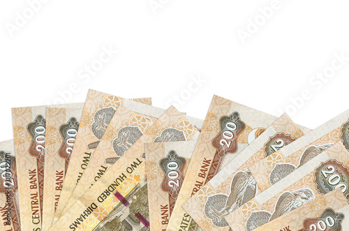 200 UAE dirhams bills lies on bottom side of screen isolated on white background with copy space. Background banner template photo