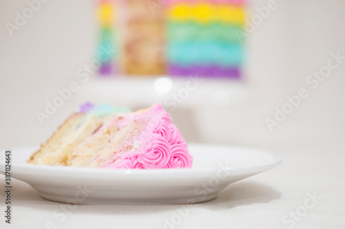 Round cake decorated with rainbow photo