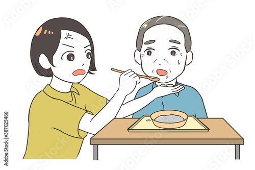 食べ物をこぼす高齢男性　つい怒る女性介護士