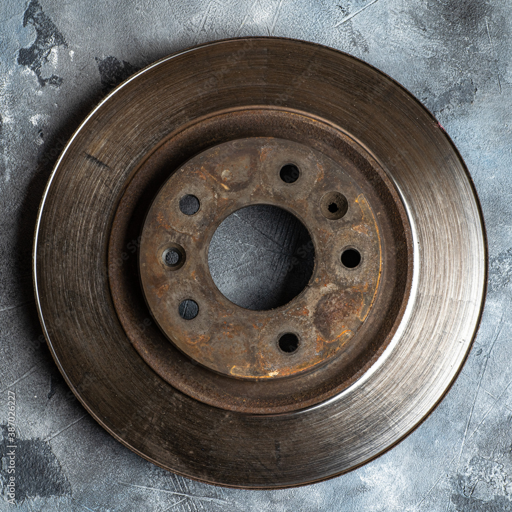 Old used car rotor brake disc, close up. - obrazy, fototapety, plakaty 