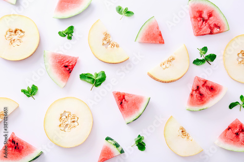 Fototapeta Naklejka Na Ścianę i Meble -  Sliced watermelon and melon pattern on white background. Top view