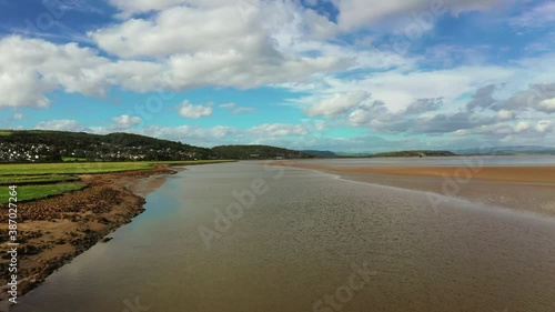 Wallpaper Mural Aerial rising forward motion over a coastal bay at low tide, bright sunny day. Torontodigital.ca