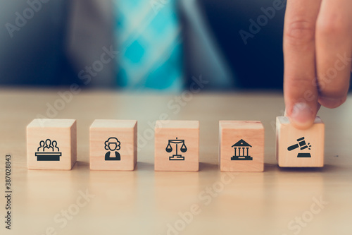 Murais de parede man hand arranging on wooden cube block with legal justice icon