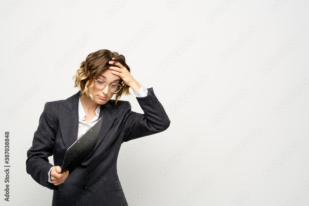 Woman in business suit finances work documents glasses hairstyle Woman in business suit finances work documents glasses hairstyle
