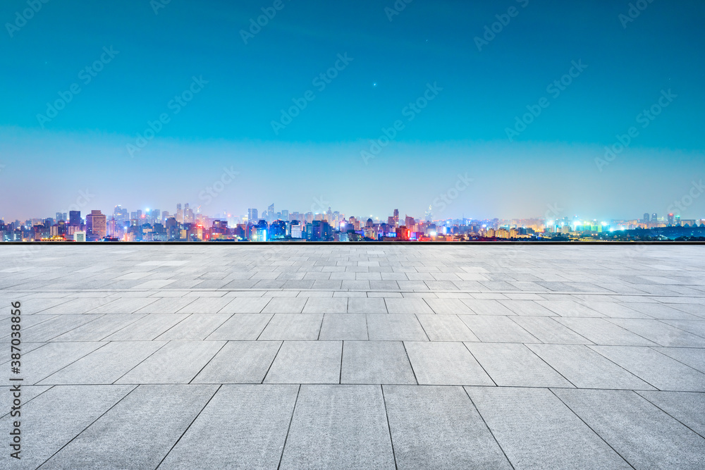 Fototapeta premium Empty square floor and city skyline with buildings in Hangzhou at sunrise.