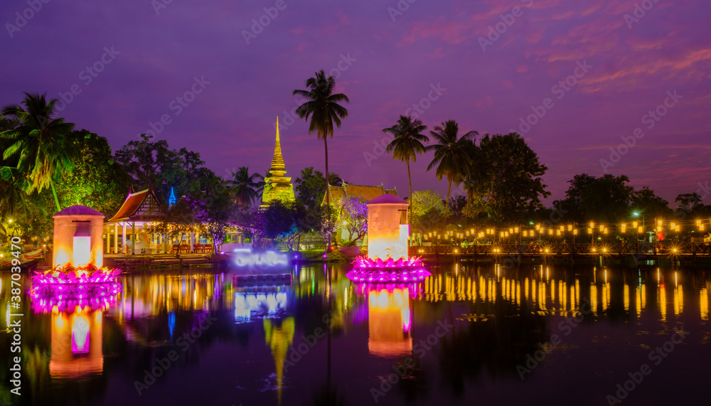 night view of Buddhist temple on the river