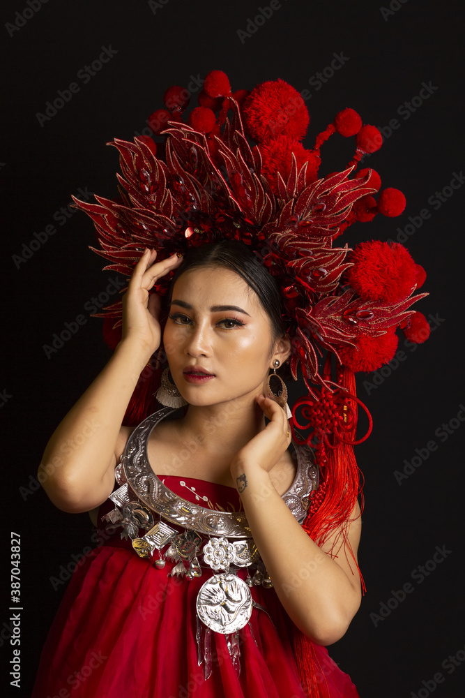 Close up portrait of young women wearing red clothes on a black background. Fashion photo studio Close up portrait of young women wearing red clothes on a black background. Fashion photo studio