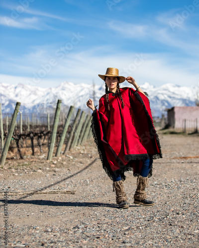 woman in a pocho in the mountains