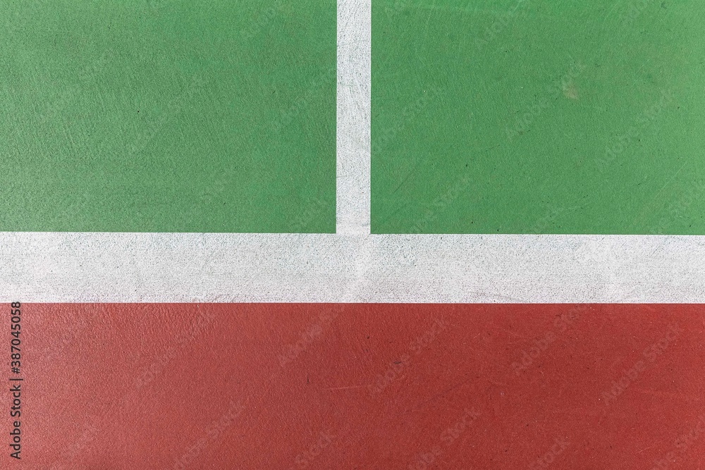 A close up of white lines on the tennis court floor A close up of white lines on the tennis court floor