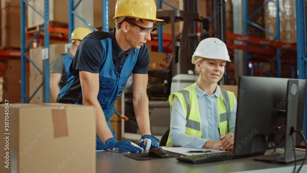 In Retail Warehouse Manager Uses Computer with Inventory Checking Software, Talks with Storehouse Worker about Package Delivery. International Distribution Center with Shelves Full of Products 