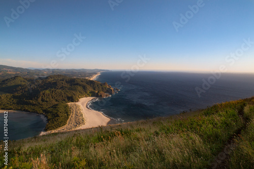 A view of the Oregon Coastal mountains and ocean toward the horizon as seen from the top of the Cascade Head Preserve