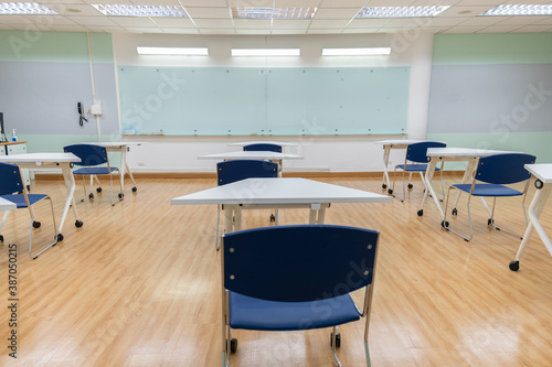 Interior empty classroom in university, Concept of back to school, setting of chair in the room design social distancing