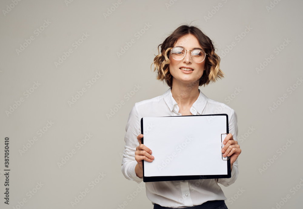 Woman on light background with document folder white shirt glasses mockup Woman on light background with document folder white shirt glasses mockup