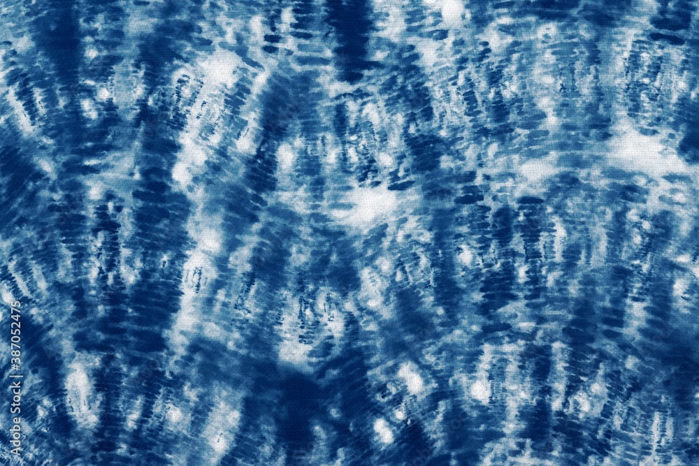 Indigo Blue Shibori Tie dye fabric texture pattern. White and Blue colors. Indigo Blue Shibori Tie dye fabric texture pattern. White and Blue colors.