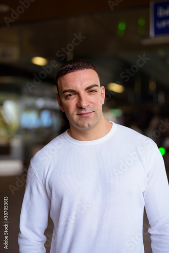 Portrait of handsome man at the sky train station