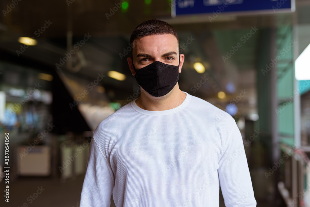 Portrait of man wearing mask and social distancing at the sky train station Portrait of man wearing mask and social distancing at the sky train station