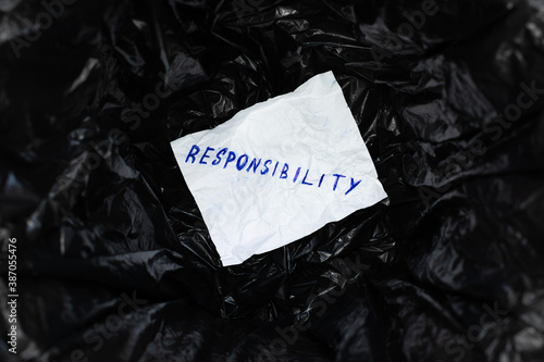 Crumpled white sheet of paper with word 