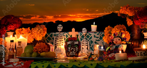Mexican day of the dead altar at sunset at dim candlelight photo
