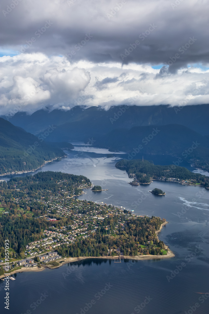 Aerial view of an Ocean Inlet in a modern city during a cloudy morning. Taken in Deep Cove, Vancouver, British Columbia, Canada.