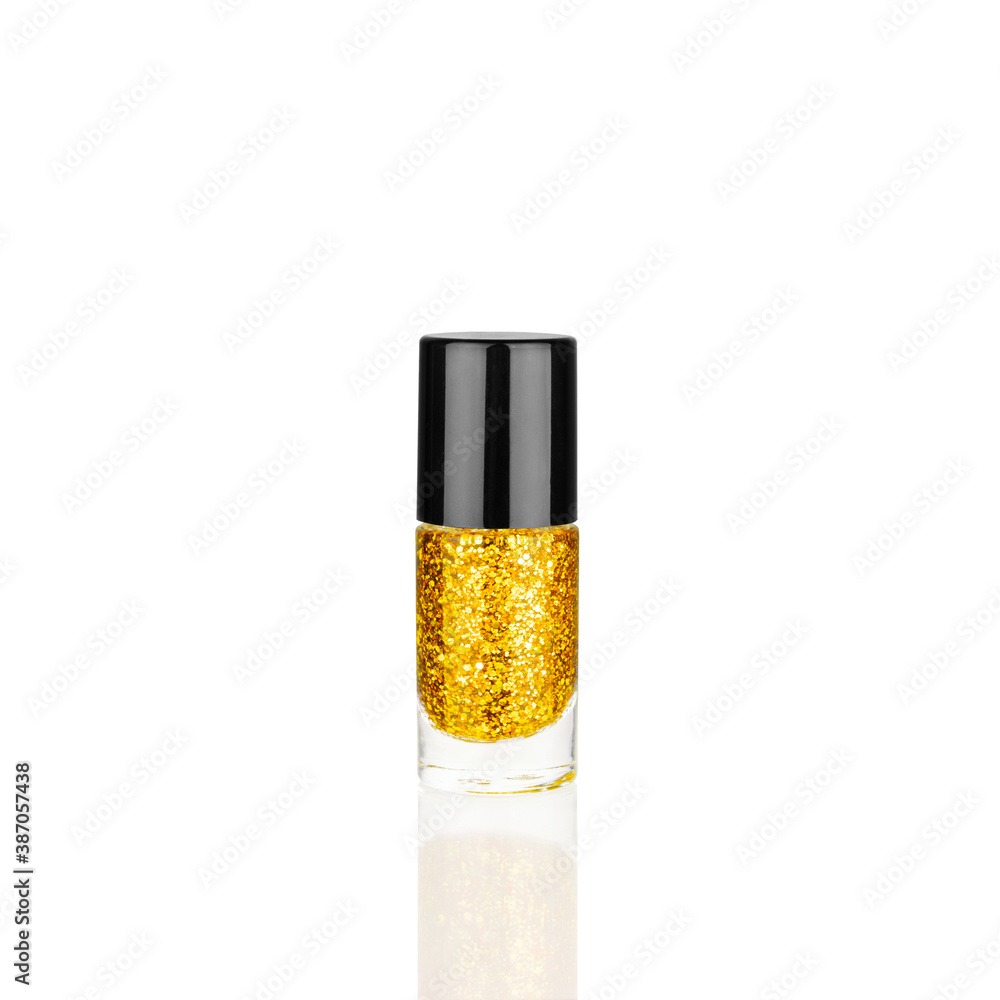 Golden glittering nail polish glass bottle on white background isolated close up, closed gold sequin varnish, bright shiny yellow lacquer, sparkling enamel, beautiful shimmer gel, cosmetic accessory Golden glittering nail polish glass bottle on white background isolated close up, closed gold sequin varnish, bright shiny yellow lacquer, sparkling enamel, beautiful shimmer gel, cosmetic accessory