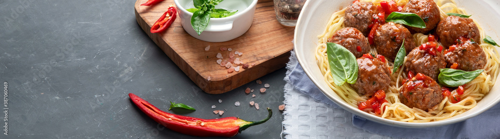 Fototapeta premium Meatballs with tomato sauce and spaghetti