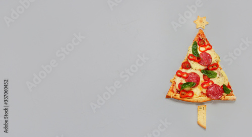 Piece of pizza set like christmas tree.