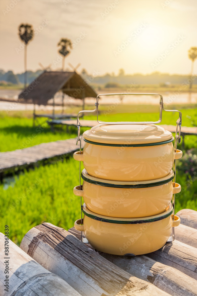 Fototapeta premium Zinc coated food carrier in Thailand countryside, beautiful natural farm atmosphere in the morning