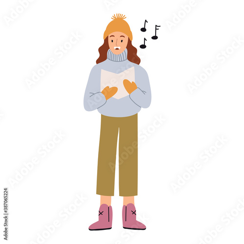 Cute young girl dressed in outerwear singing Christmas carol isolated on white background . 