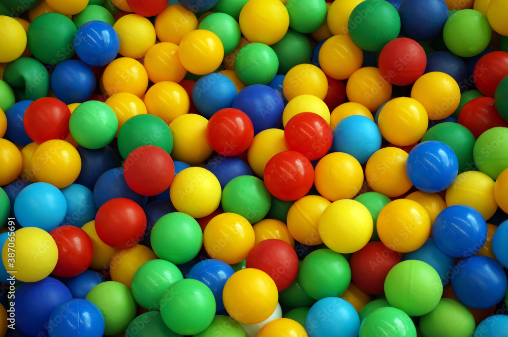 red, yellow, green, blue plastic balls closeup red, yellow, green, blue plastic balls closeup