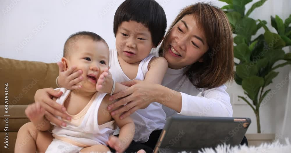 Happy family with mother and kids spending time together at home. Happy family with mother and kids spending time together at home.