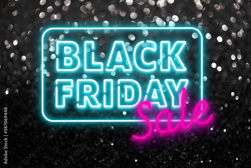 Fototapeta premium Text BLACK FRIDAY SALE on dark background with glitters