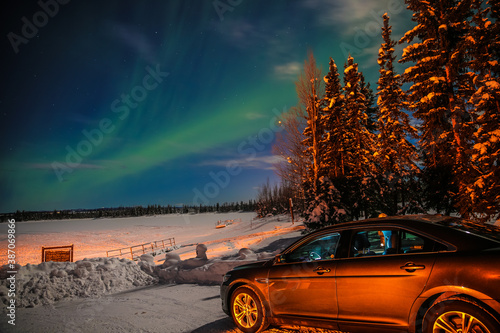 Northern Lights on a full moon night, Fairbanks, Alaska. Chena Lake Recreation Area in winter photo
