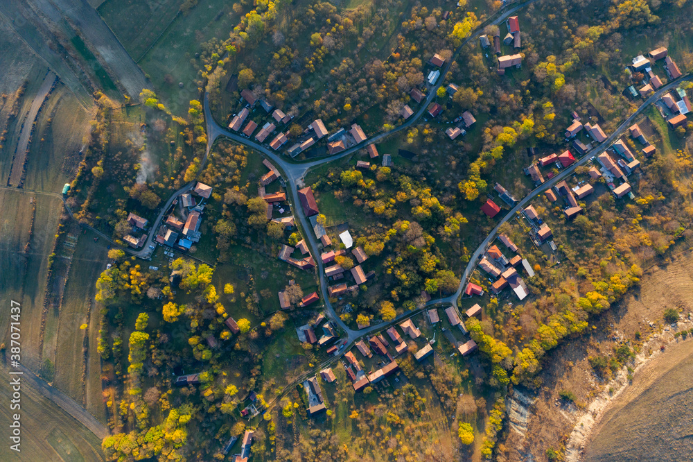 Aerial drone point of view of village streets in the autumn