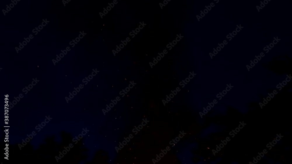 flames and sparks from a fire on a black background at night, adventure flames and sparks from a fire on a black background at night, adventure