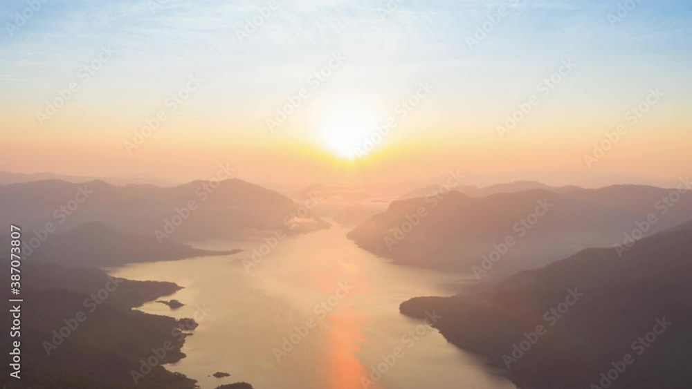 Hyper-lapse 4K, Aerial view, morning view and sunrise over Bhumibol Dam viewpoint, Mae Ping National Park, Lamphun Province, Thailand. Hyper-lapse 4K, Aerial view, morning view and sunrise over Bhumibol Dam viewpoint, Mae Ping National Park, Lamphun Province, Thailand.