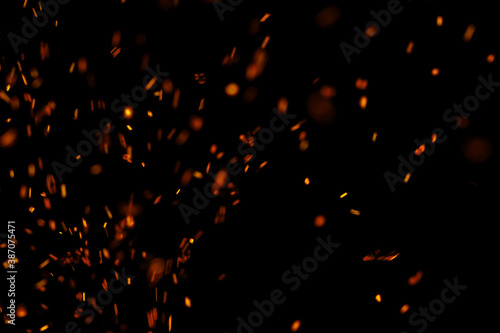 Obraz na plátně flame fire with sparks on black background