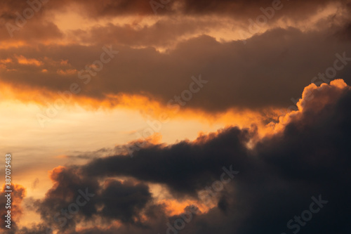 clouds with black clouds at sunset as background © studybos