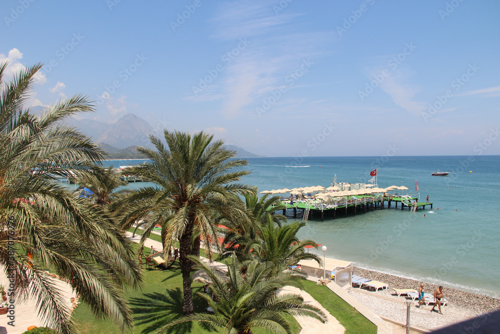 seashore with clear water with hills and pontoon seashore with clear water with hills and pontoon