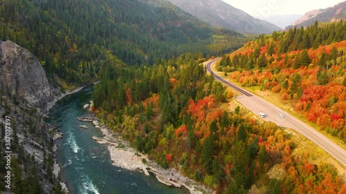 Flying over the Snake River in Wyoming, surrounded by trees turning their fall colors photo