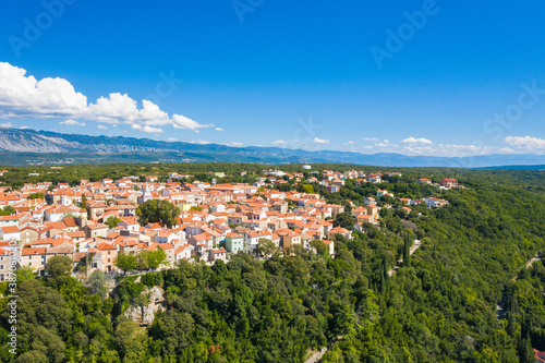 Fototapeta Naklejka Na Ścianę i Meble -  Aerial view of the old town of Omisalj on high cliff, Krk island, Kvarner, Croatia