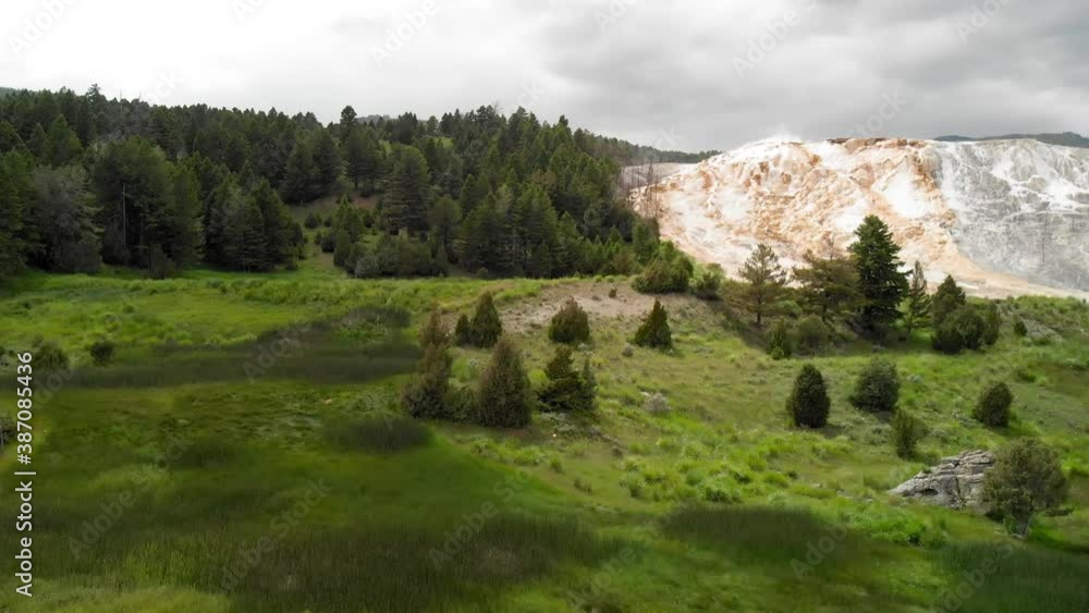 Mammoth Hot Springs aerial view of mountain and meadows, Yellowstone National park. Slow motion Mammoth Hot Springs aerial view of mountain and meadows, Yellowstone National park. Slow motion