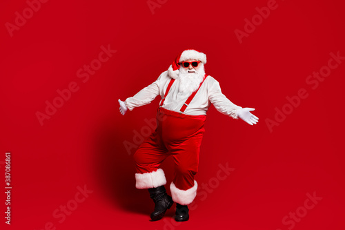 Full length body size view of his he attractive cheerful funny white-haired Santa father having fun dancing night club event isolated bright vivid shine vibrant red burgundy maroon color background